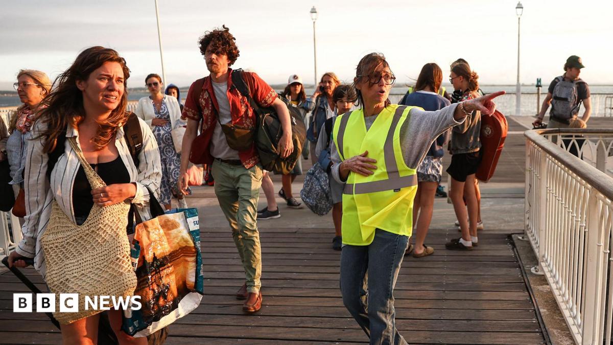 Tens of thousands evacuated from French tourist spot and near Madrid as wildfires spread